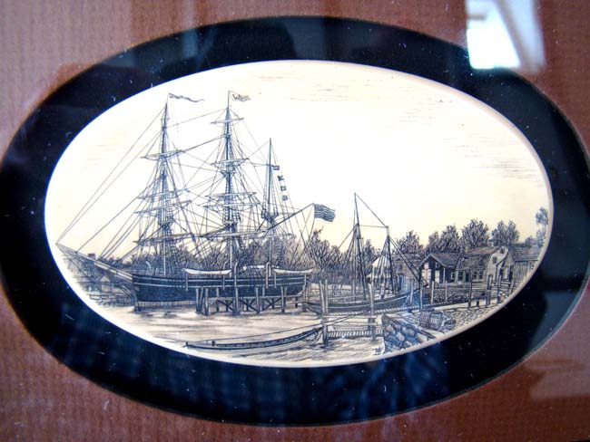A vintage faux scrimshaw medallion by artist Stephen Barlow circa 1978